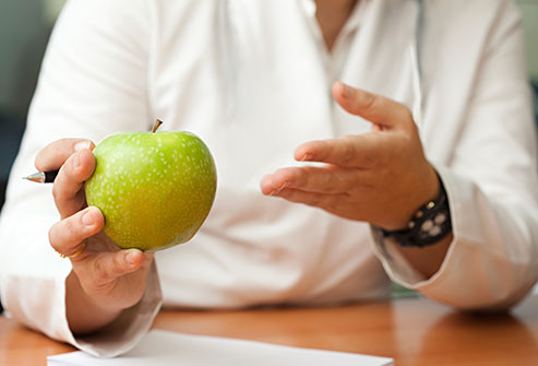 getty_rf_photo_of_nutritionist_with_apple