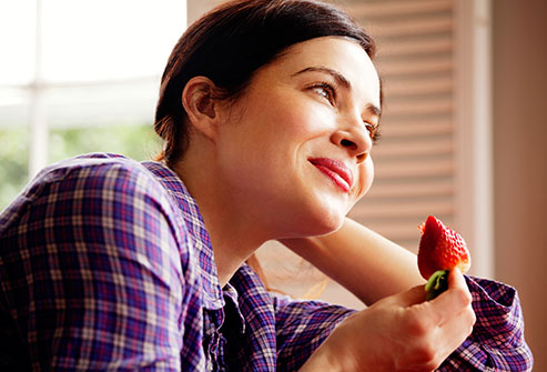 getty_rm_photo_of_woman_eating_strawberry